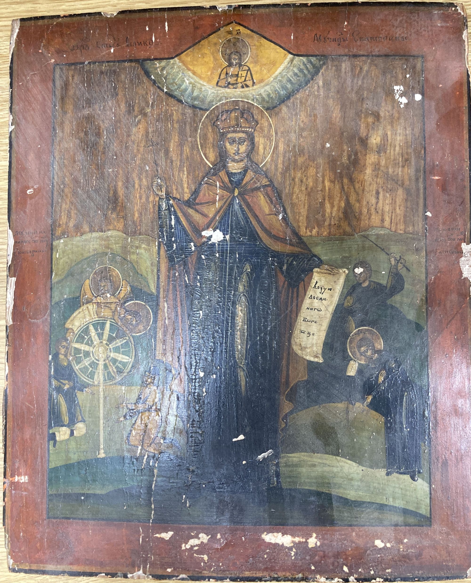 Russian School, tempera on panel, Icon with standing figure and attendants, inscribed, 37 x 31cm